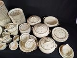 many different types of dishes and cups on the table