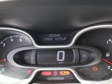 the dashboard of a car with a digital clock on it ' s display