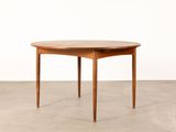 a round wooden table with two legs and a wooden top