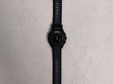 a close up of a watch on a table with a white background