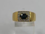 a close up of a gold ring with a blue stone surrounded by diamonds