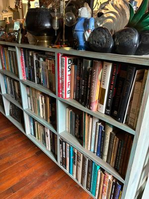 a book shelf with many books on top of it