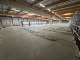 a large warehouse with a lot of windows in the middle of it