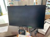 a computer monitor sitting on top of a desk in a store