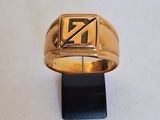 a picture of a gold ring with the letter n on it