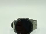 a close up of a smart watch on a white surface