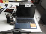 a laptop computer sitting on top of a desk