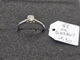 a ring with a diamond on it and a price tag on it