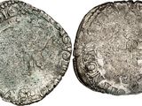 a silver coin with an image of a man on it