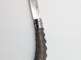 a knife that is laying on a table