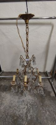 a chandelier hanging from the ceiling in a room