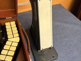 an old typewriter and a wooden case on a table