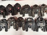 many different types of pipe cutters sitting on a table