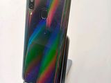 an image of a close up of a cell phone on a stand