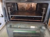 an open oven that has some food inside of it
