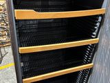 an open refrigerator with a lot of shelves inside of it