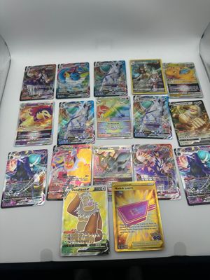 a lot of pokemon cards in a box on the table