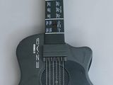 a guitar that is sitting on a white surface