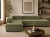a green couch and a coffee table in a living room