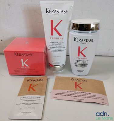 Les produits Kérastase sont posés les uns à côté des autres sur une table