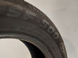 a close up of a tire on a white surface