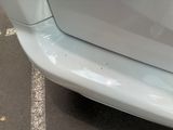 a close up of a car ' s bumper with a sticker on it