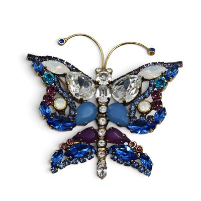 blue and purple butterfly broochle with crystals on it