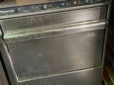 a silver dishwasher sitting on top of a kitchen counter