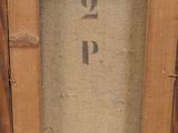 an old picture of a wooden frame with a number on it