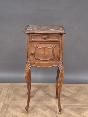 an old wooden table with a drawer on top of it