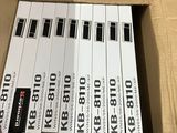 a cardboard box that has a bunch of electronic keyboards in it