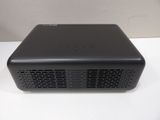 a black projector sitting on top of a white table