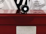 a ring that is sitting on top of a wooden box