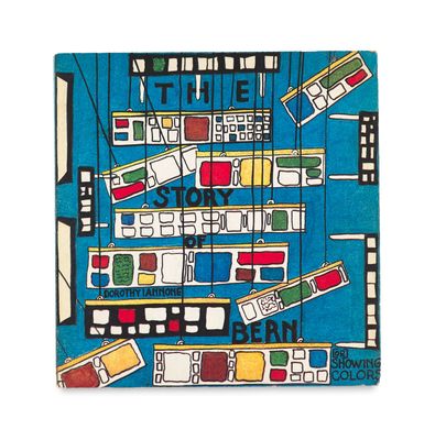 un gros plan sur un livre sur lequel figure l'image d'une ville