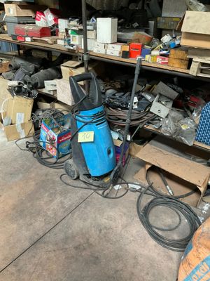 a lot of junk on the floor in the garage