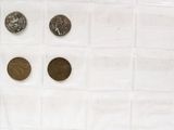 a lot of coins that are sitting on a table