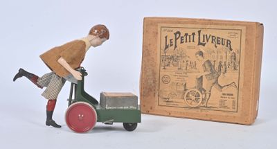 figurine représentant un homme poussant une charrette sur laquelle se trouve une caisse