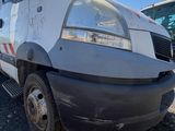 a white van that is parked in a parking lot