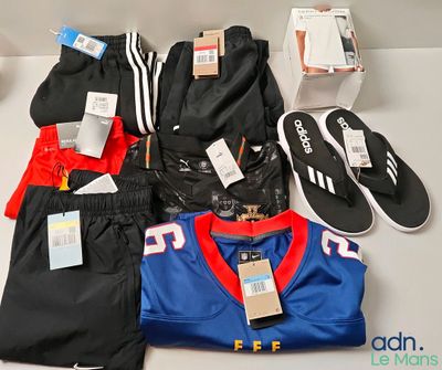 a lot of clothing and shoes on a table