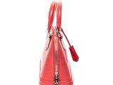 a close up of a red handbag on a white background