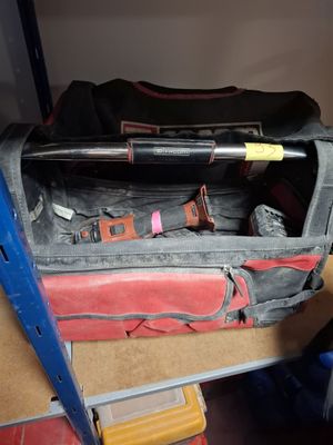 a bag with a baseball bat in it sitting on a table