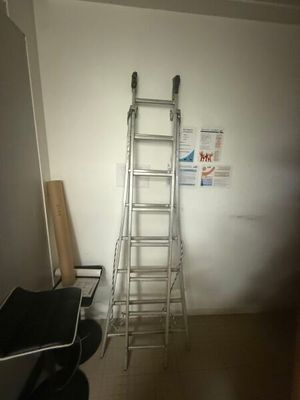 a ladder leaning against a wall in a room