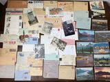 a table with many different types of postcards on it