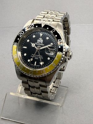 a watch that is sitting on a stand on a table