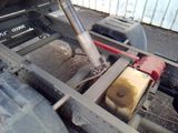 a close up of a truck ' s rear end with a pump attached to it