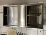 a kitchen with a stainless steel oven and sink