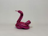 purple metal snake sculpture on white surface against a white background