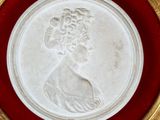 an image of a white and red plate with a woman