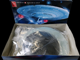 a box with a model of a star trek ship in it