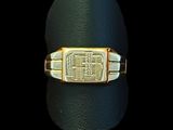 an image of a gold ring with a signet on it